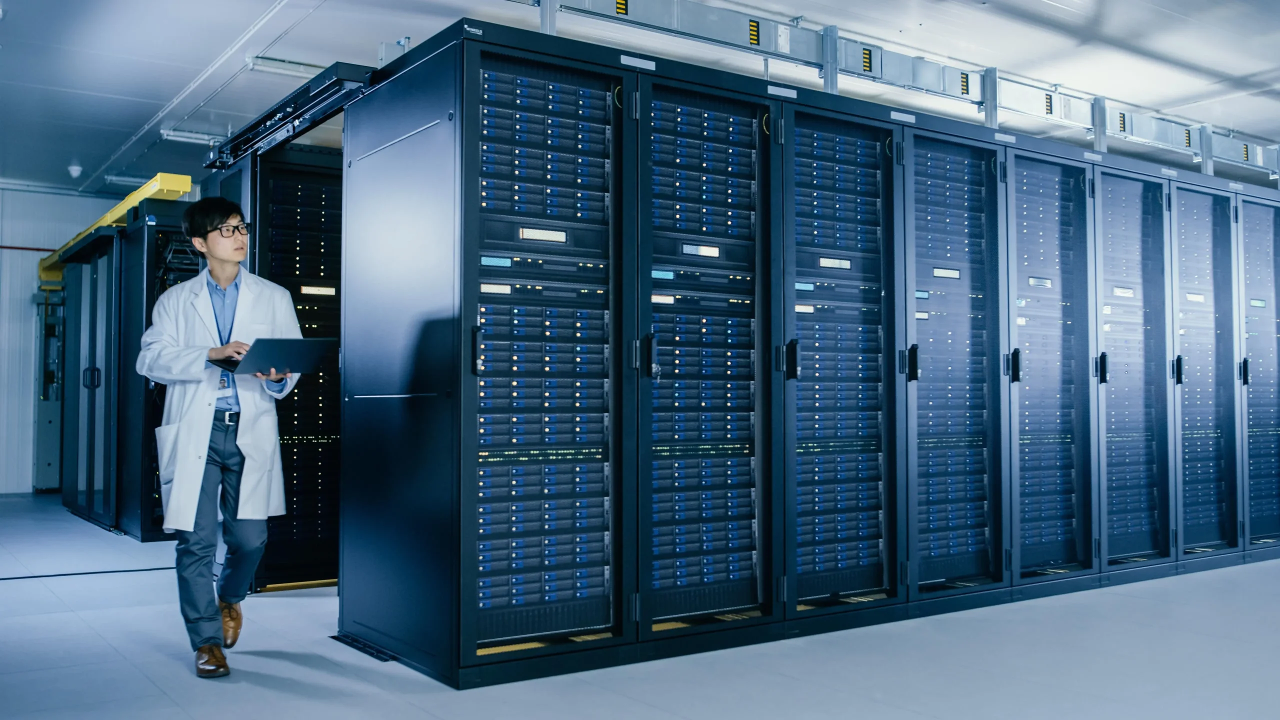 server room with man lab coat woman white lab coat standing front it scaled ai case study