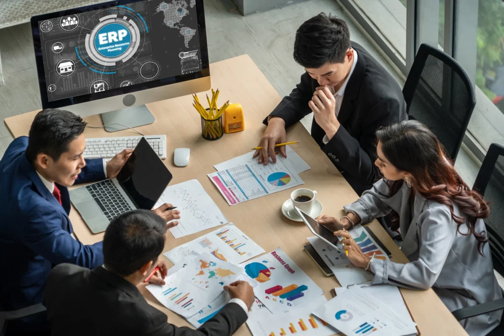 Enterprise team reviewing ERP dashboards and operational reports during an AI-powered legacy application modernization planning session